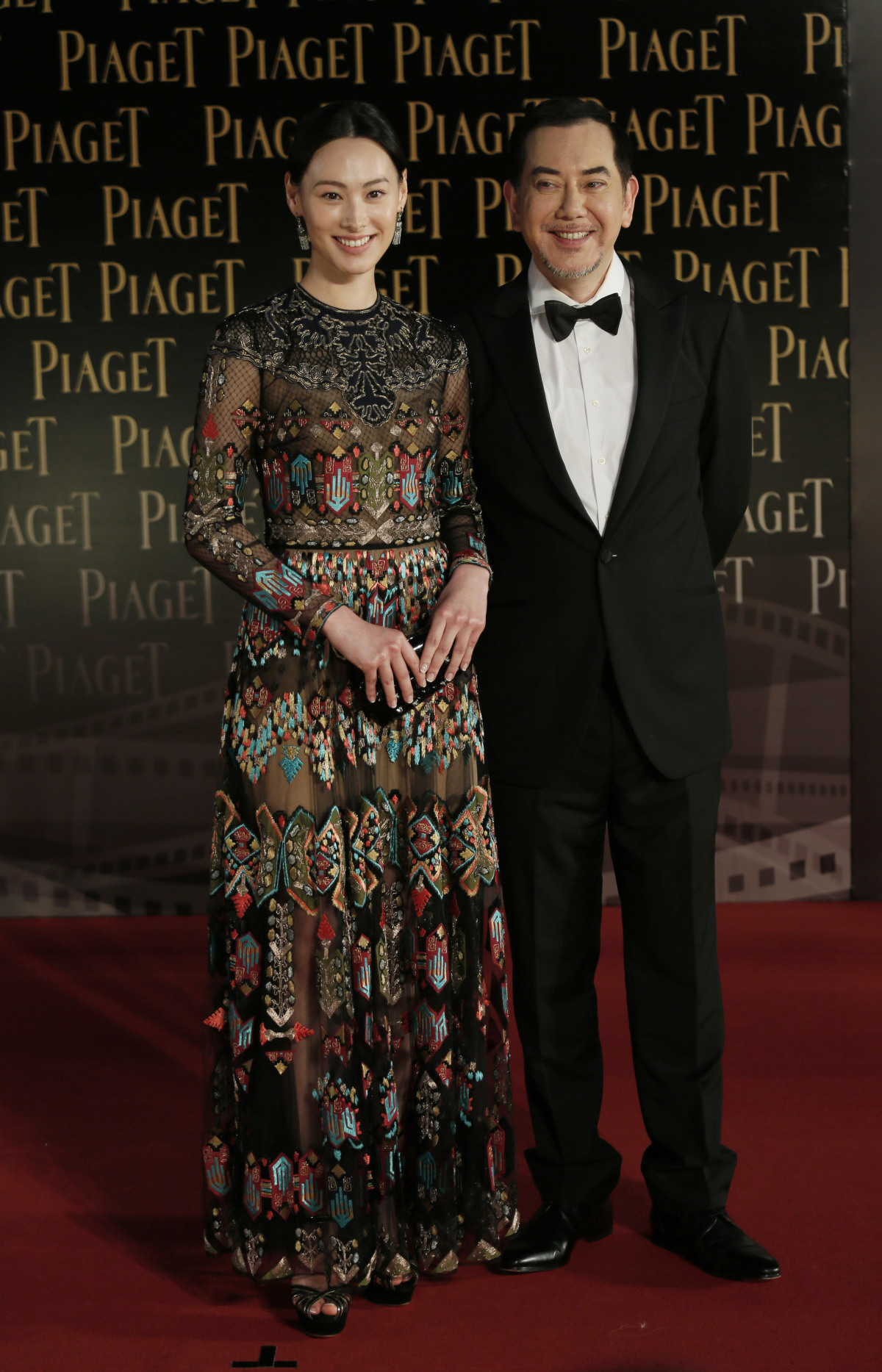 Herečka Isabella Leong (v šatách Valentino) s kolegom Anthonym Wongom. 