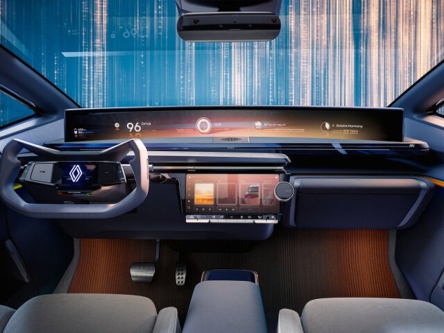 Pohľad na palubnú dosku prezrádza, ako si Renault predstavuje novú generáciu infotainmentu openR. Základom bude široký zakrivený displej pod celým čelným oknom. Vďaka nemu sa zaobíde bez head-up displeja. Ostatné funkcie sa ovládajú cez centrálnu dotykovú obrazovku.