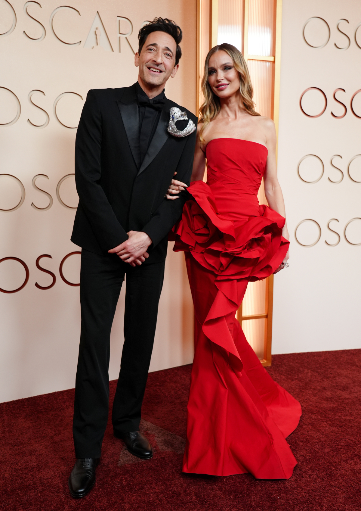 Herec Adrien Brody a jeho partnerka Georgina Chapman.